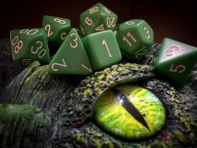 Set 7 opaque polyhedral dice: green with white figures